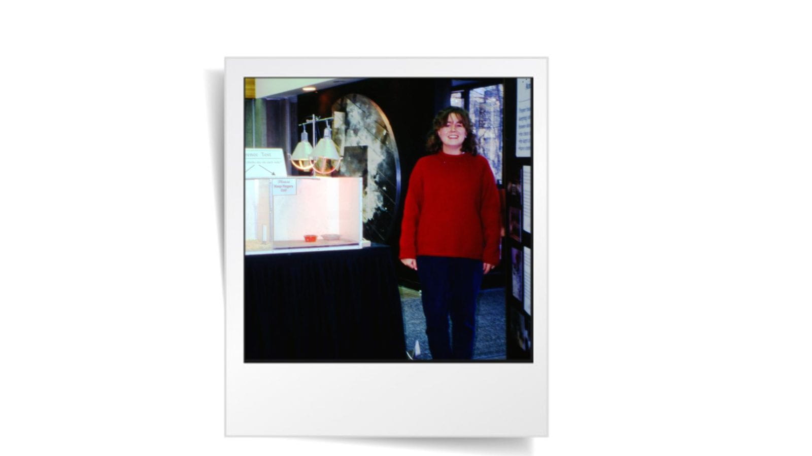 Anne Malleau, a CCSAW alum, pictured in the 1990s alongside her presentation on chick preferences.